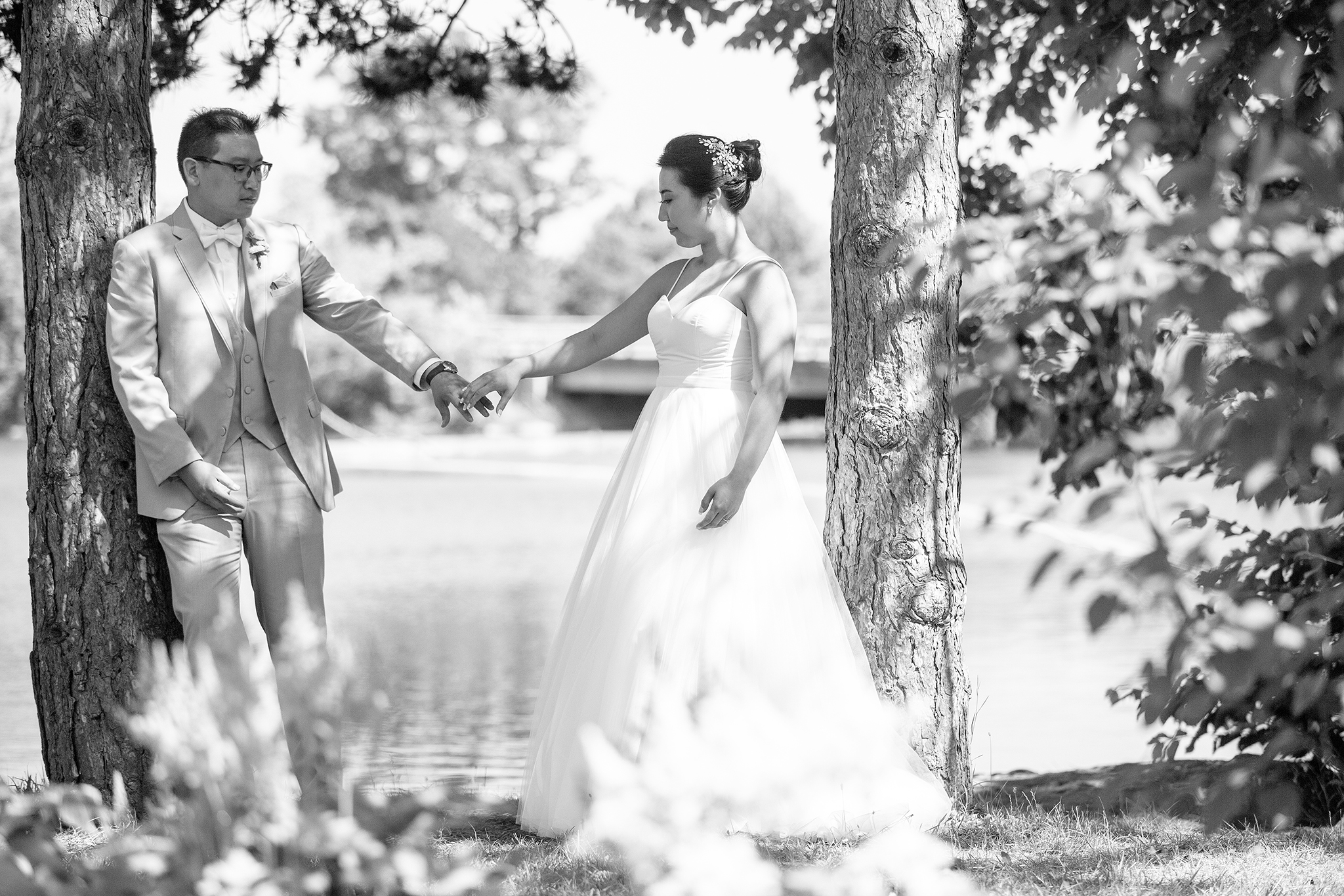 Bride and groom portrait along the river in Delaware Park Buffalo NY.